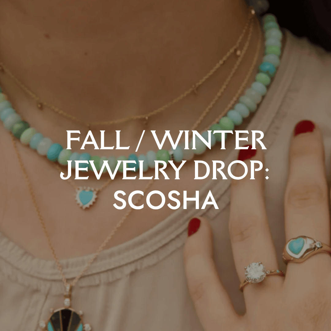Jewelry with turquoise stones and gold accents, including necklaces and rings, on a blurred background.