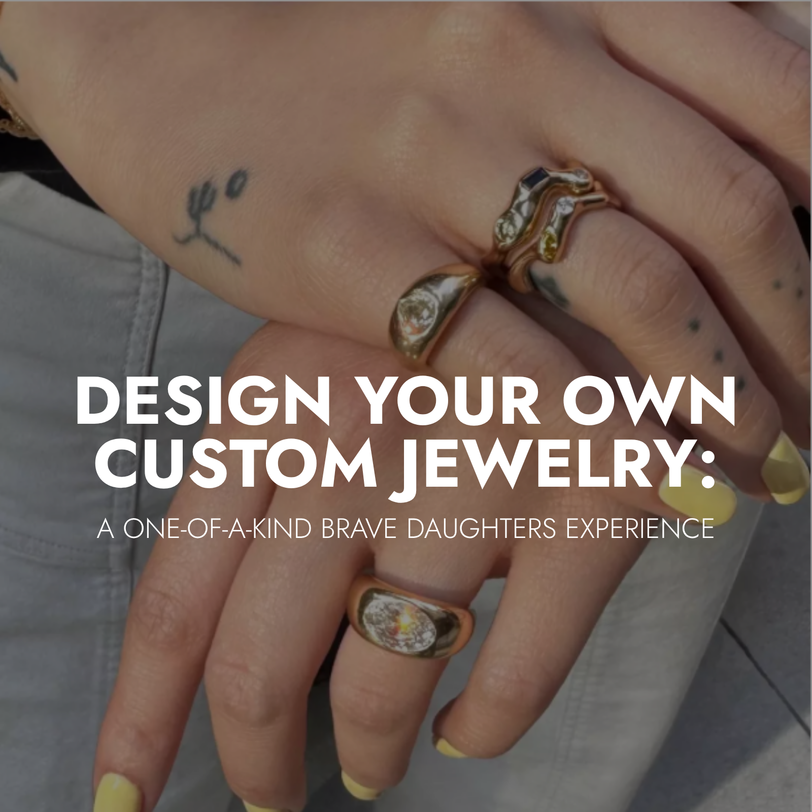 Hands wearing custom gold rings designed by Brave Daughters, featuring ethically sourced gemstones and personalized styles.