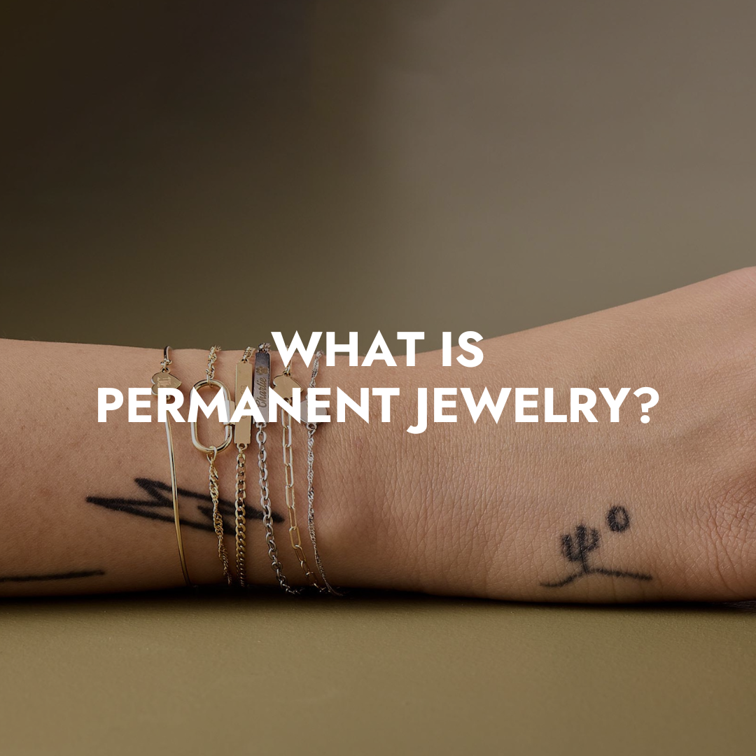 Close-up of wrist wearing multiple delicate gold and silver permanent bracelets, representing Brave Daughters’ clasp-free permanent jewelry collection.