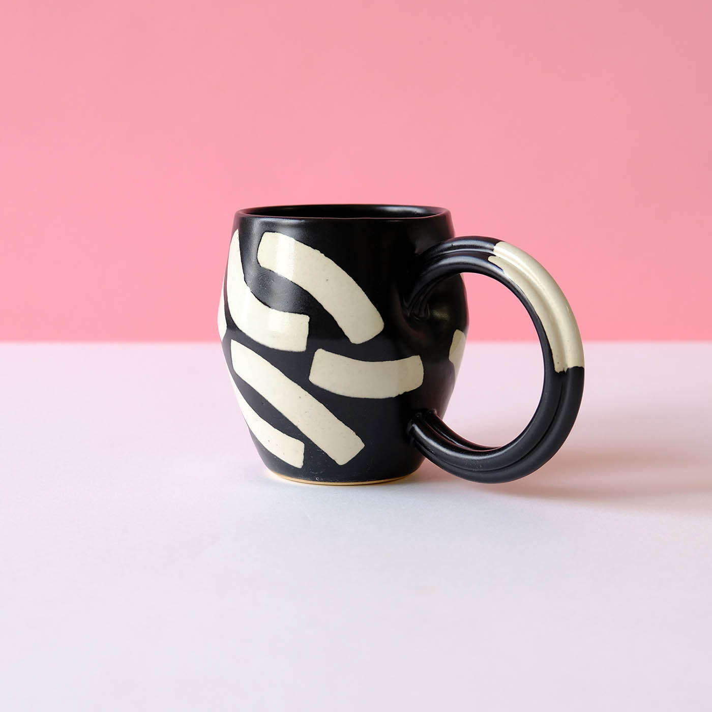 Black Mug with Eggshell Shapes