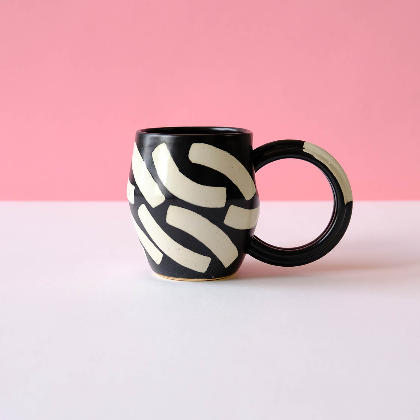 Black Mug with Eggshell Shapes