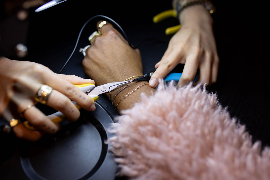 Bracelet welding during a Brave Daughters private event or pop-up — permanent jewelry crafted on-site for a one-of-a-kind fine jewelry experience.