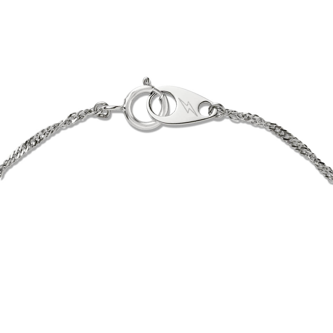Close-up of Brave Daughters' custom white gold spring ring clasp engraved with lightning bolt logo — a signature fine jewelry finish designed for secure wear and elevated branding.
