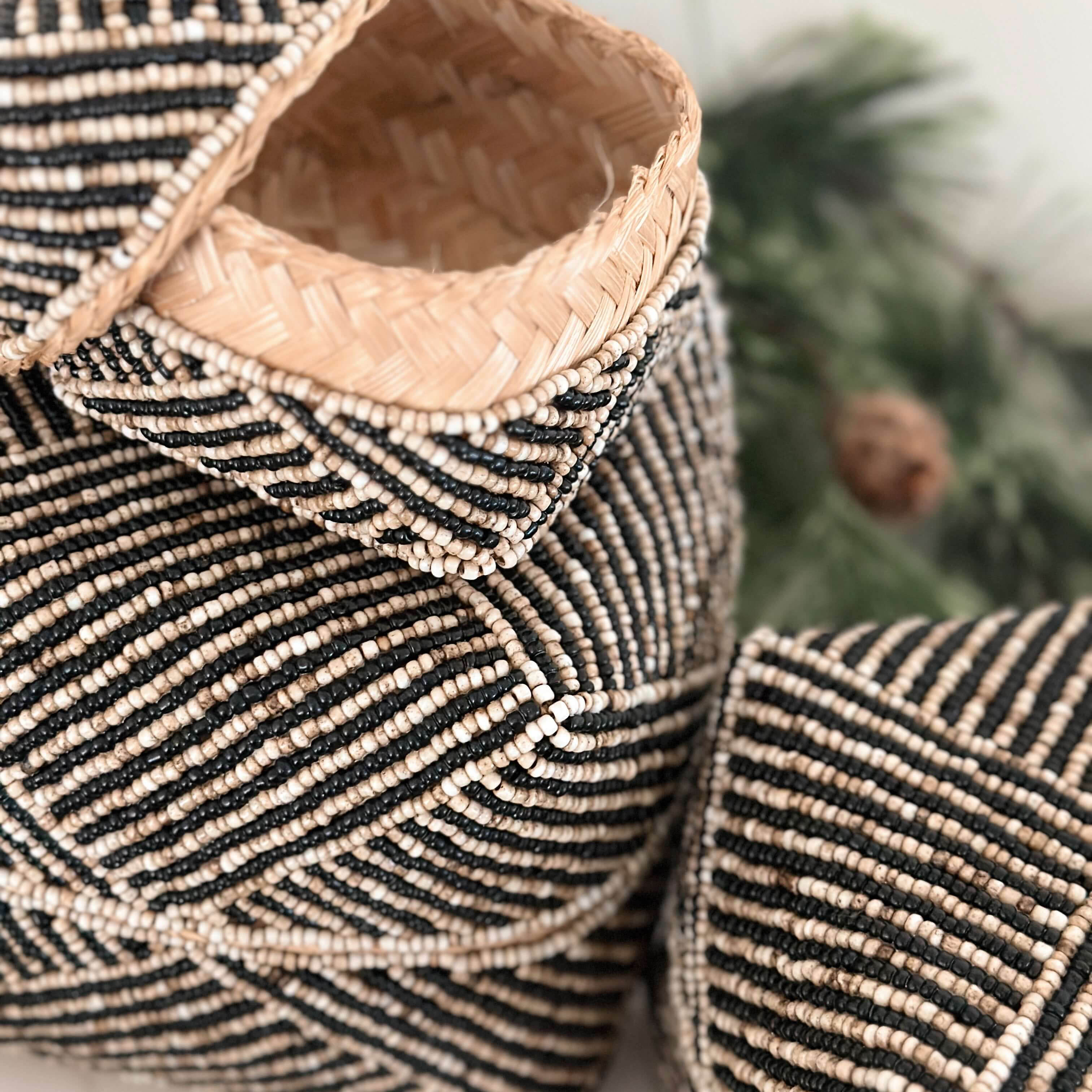 NALA Beaded Bamboo Basket Nesting Trio Set with intricate black and white beadwork, showcasing handcrafted design and natural bamboo elements for home decor and storage.