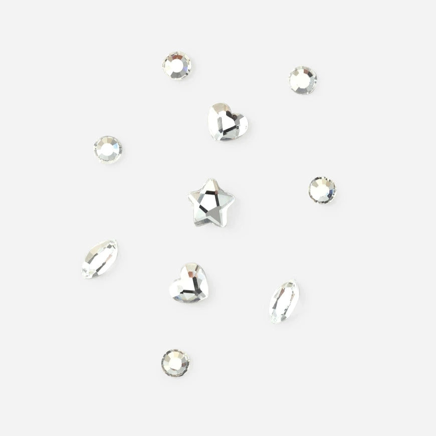 Small tooth gem crystals on a white background
