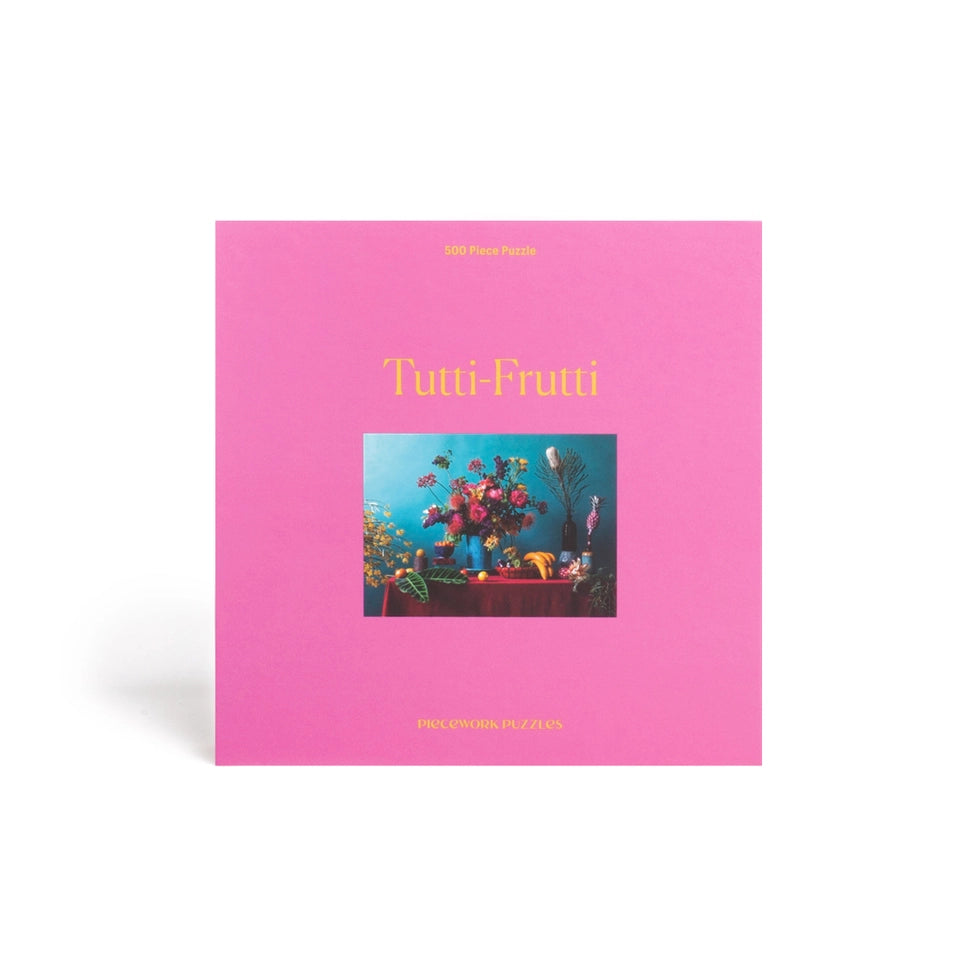 Pink box titled 'Tutti-Frutti' with a colorful illustration on a white background