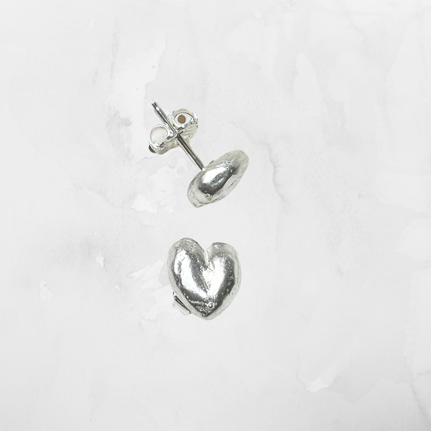 Puffy heart earrings in silver, showcasing a unique vintage design, ideal for jewelry lovers on the Brave Daughters e-commerce platform.
