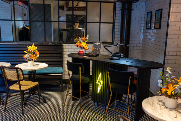 Brave Daughters private jewelry event setup featuring floral decor, fine jewelry displays, and permanent bracelet welding stations.