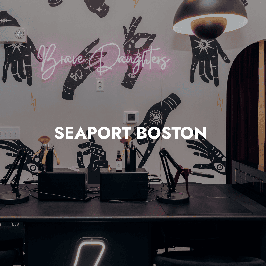 Interior of Brave Daughters at The Superette in Boston’s Seaport, showcasing permanent jewelry chains.