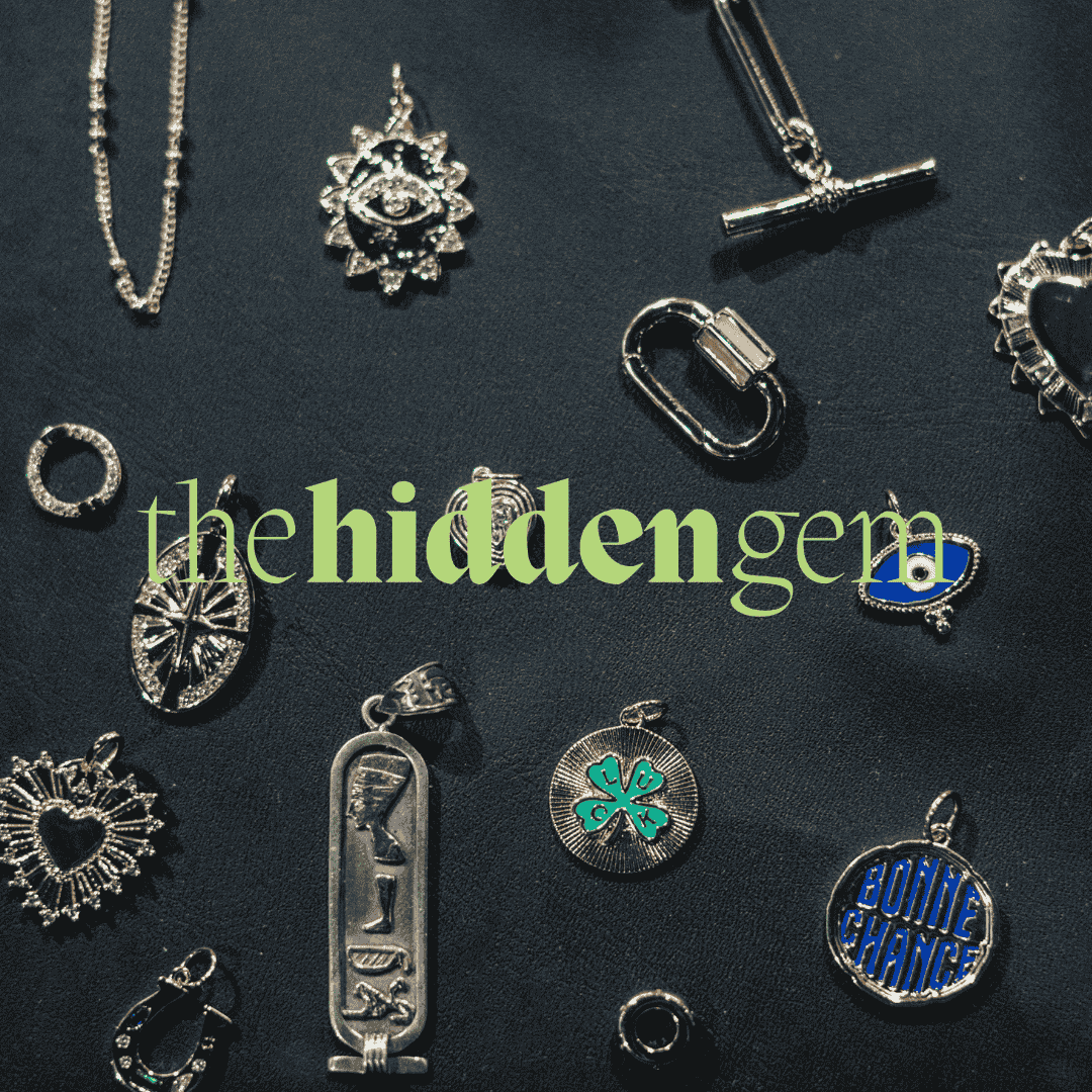 Jewelry charms displayed on a dark background with “the hidden gem” text overlay.