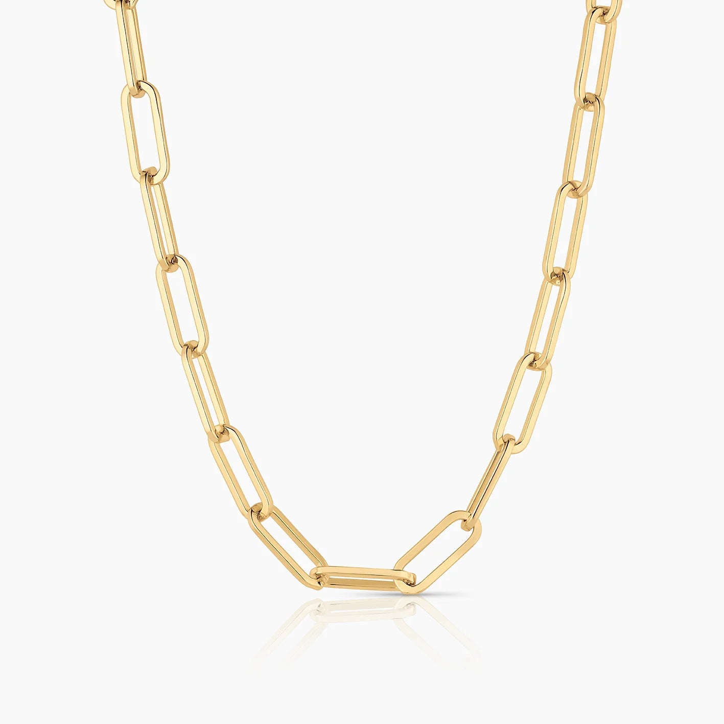Gold chain necklace on a white background