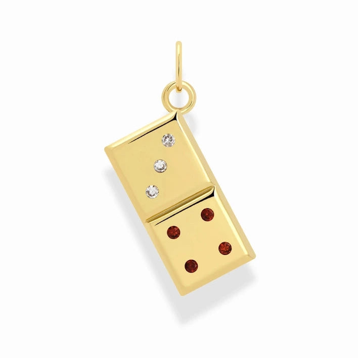 a gold charm in the shape of a domino with cubic zirconia accents on a white background