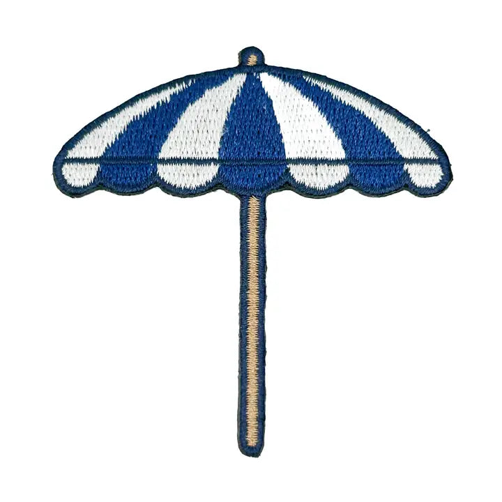 a blue and white umbrella patch on a white background