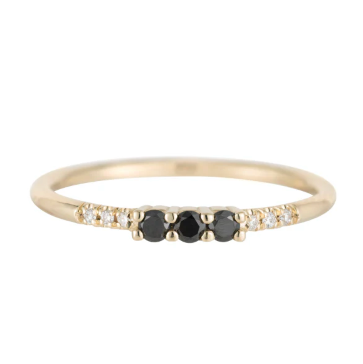 She's striking in her streamlined profile and adds just a bit of definition to your stack. Three 3 x 1.5 mm black diamond baguettes Six 1 mm white diamonds 14k yellow gold