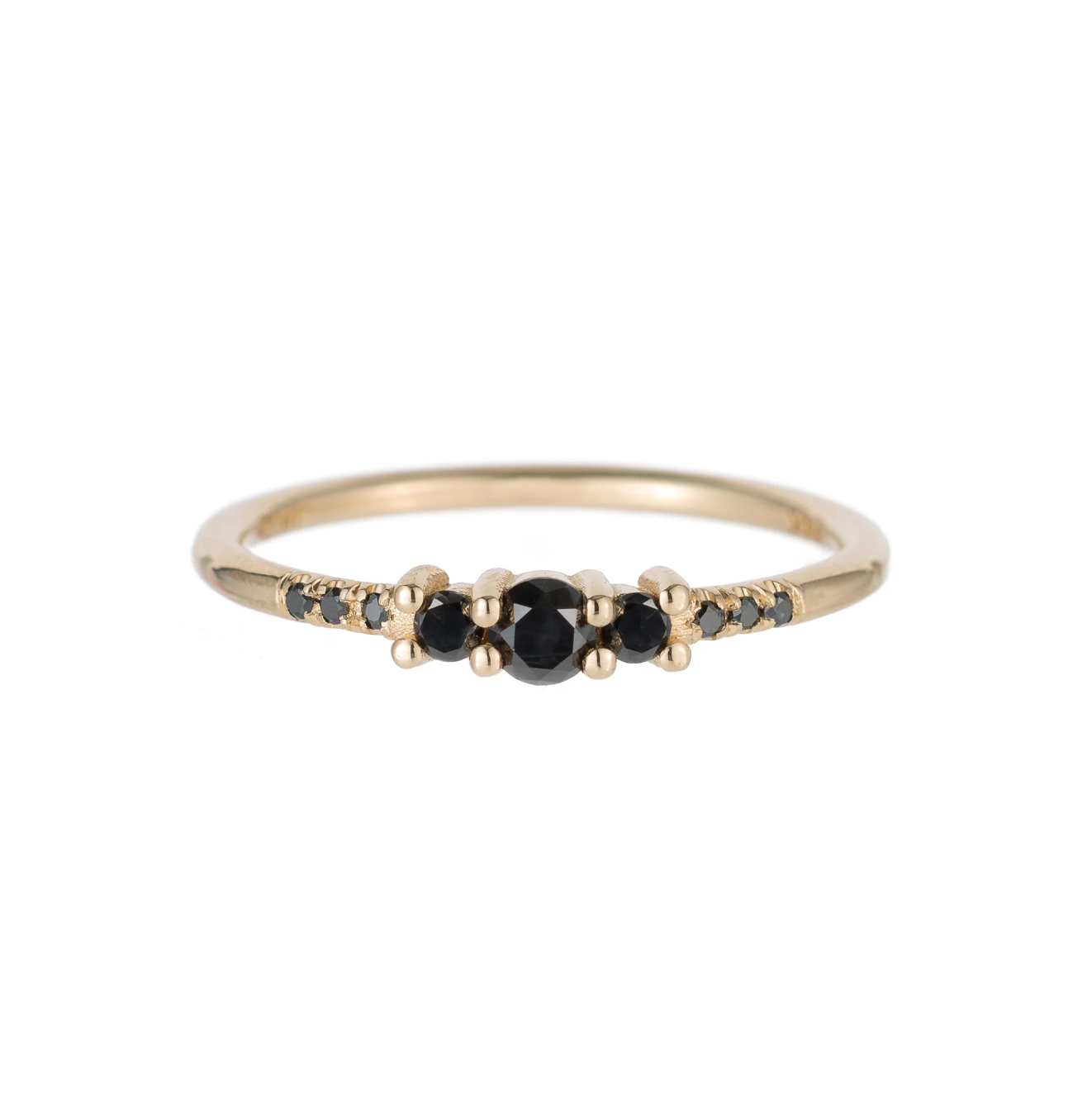 A beautiful trio of black diamonds, scaled to perfection and accented with their signature equilibrium style diamonds. She feels a bit more substantial and will mix in seamlessly with your current stack, or sit confidently on her own.

3 mm black diamond
2 mm black diamonds
six 1 mm black diamonds
14k Yellow Gold