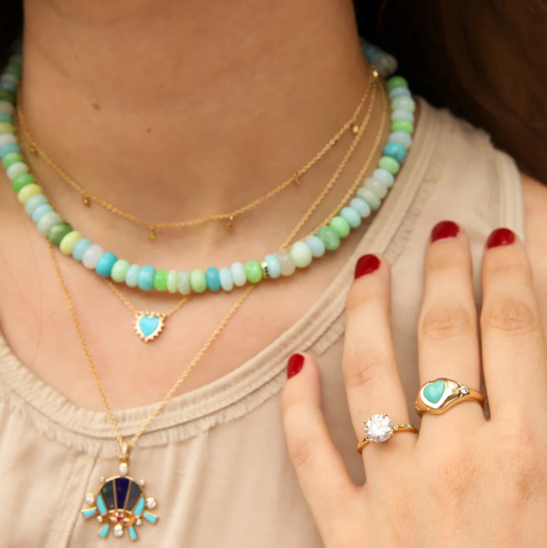 Designed with a colorful "Ocean Blend" of gemstone beads like lapis lazuli, opal, turquoise, dyed shell, agate, and moonstone. A silver button closure and diamond bead add an extra dimension of sparkle. 16" length.