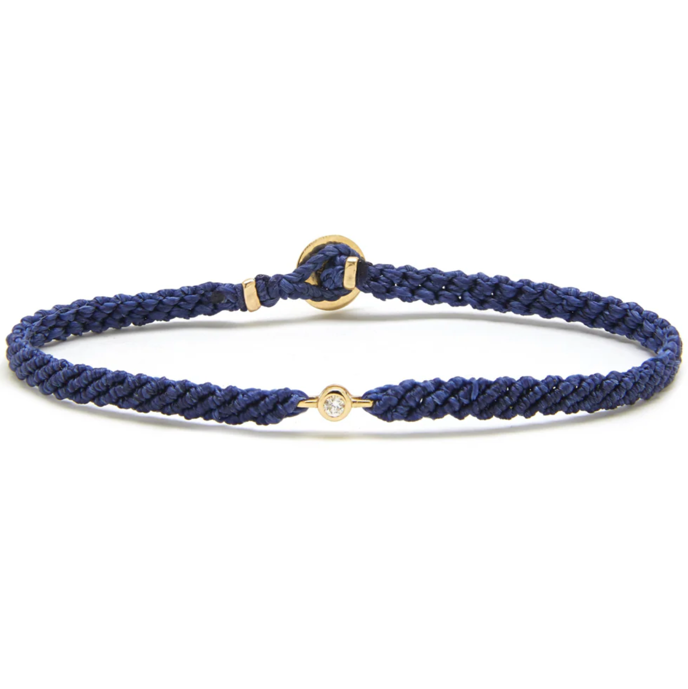 Navy braided nylon bracelet with 10k gold bezel set diamond on a white background