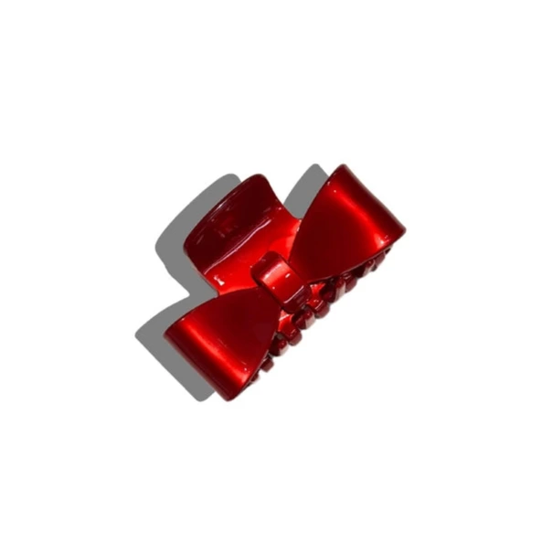 Red hair clip on a white background