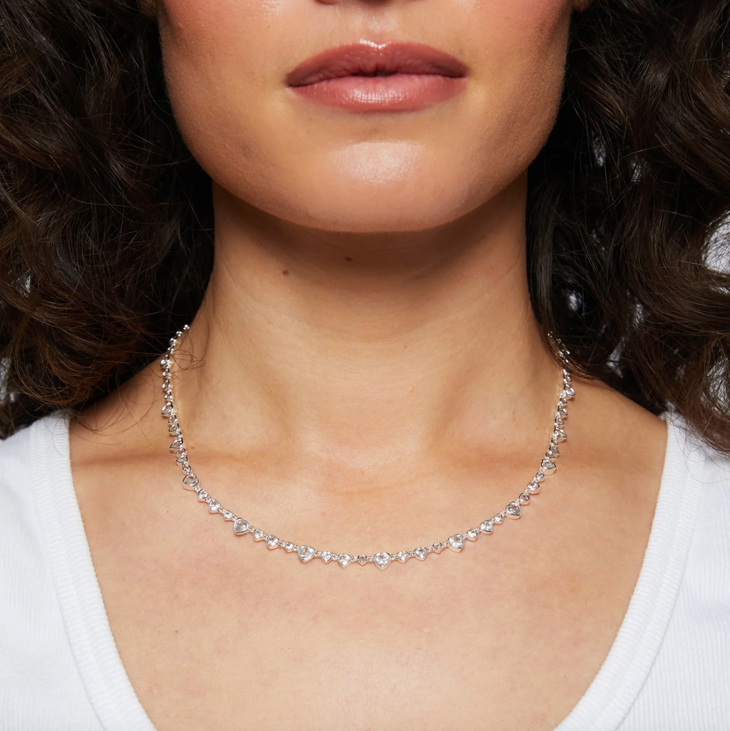 Heart-shaped CZs necklace on model