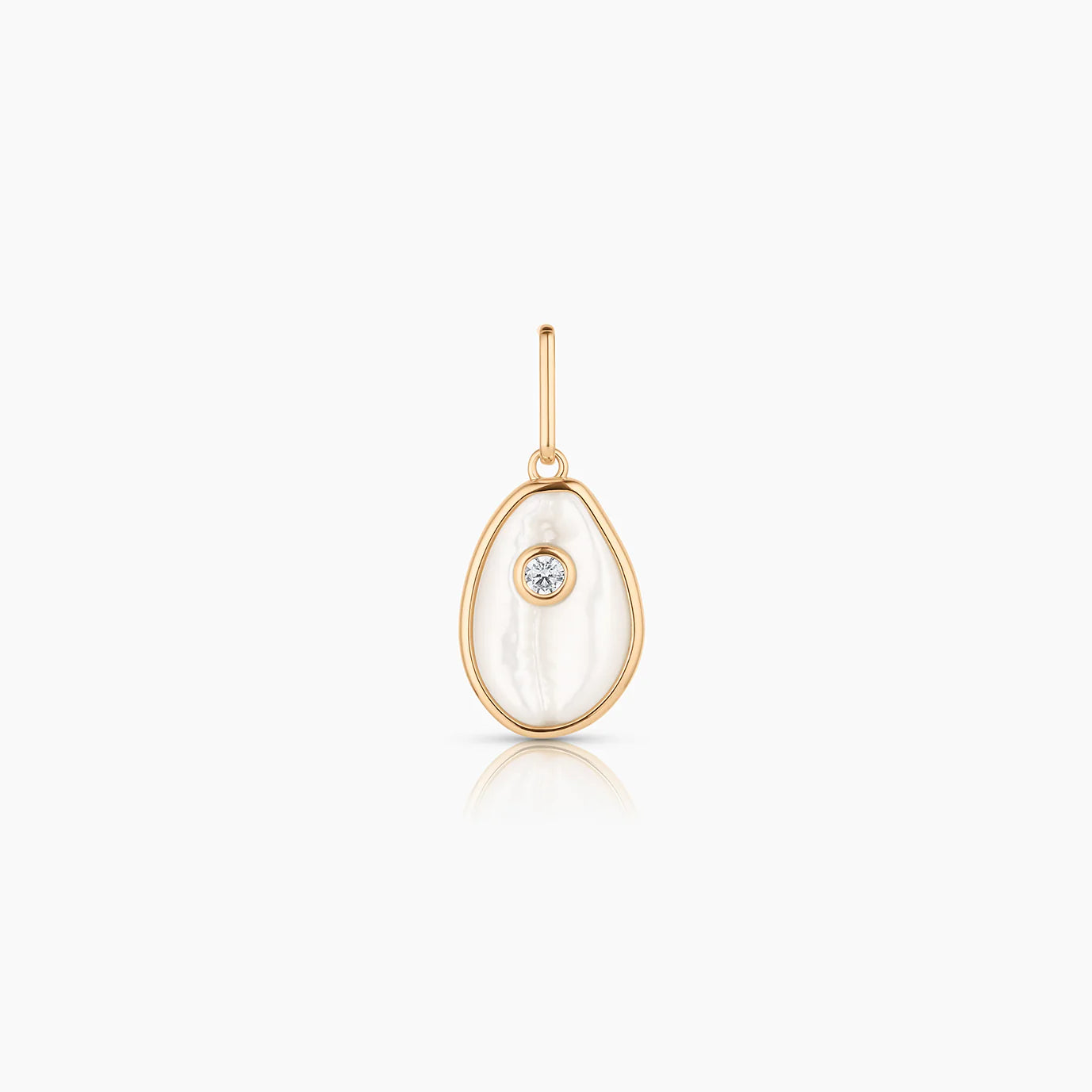 Gold pendant with a central gemstone on a white background