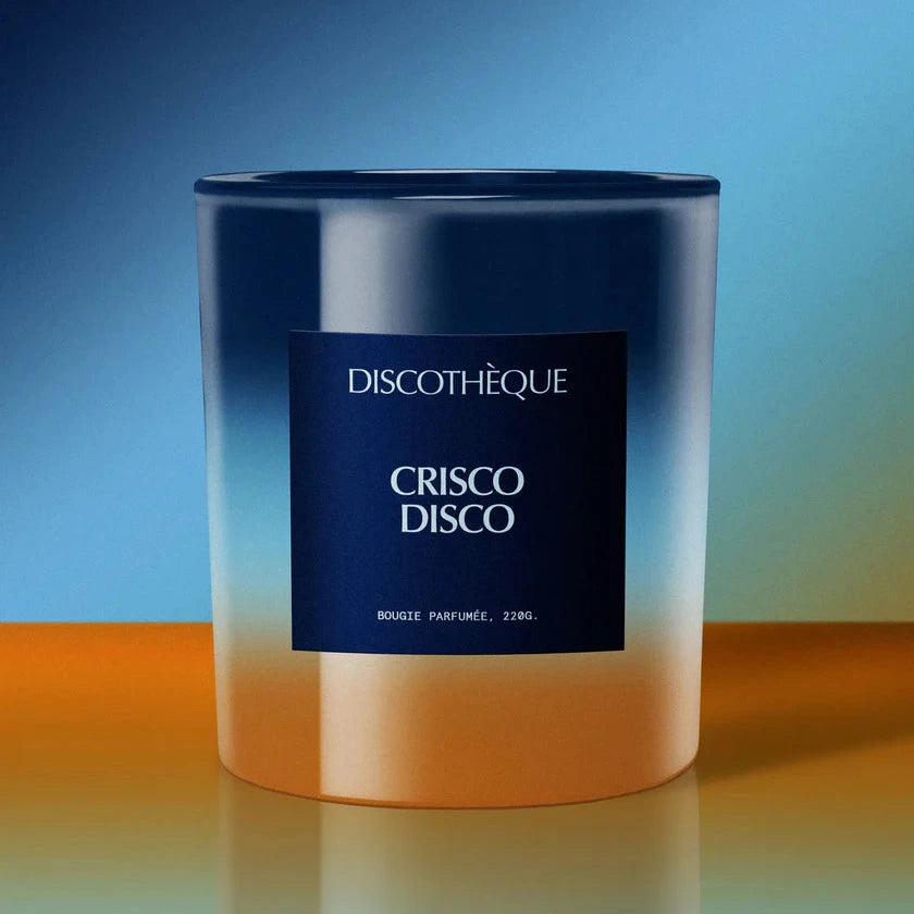 Candle labeled 'Discotheque Crisco Disco' with a gradient blue to orange background