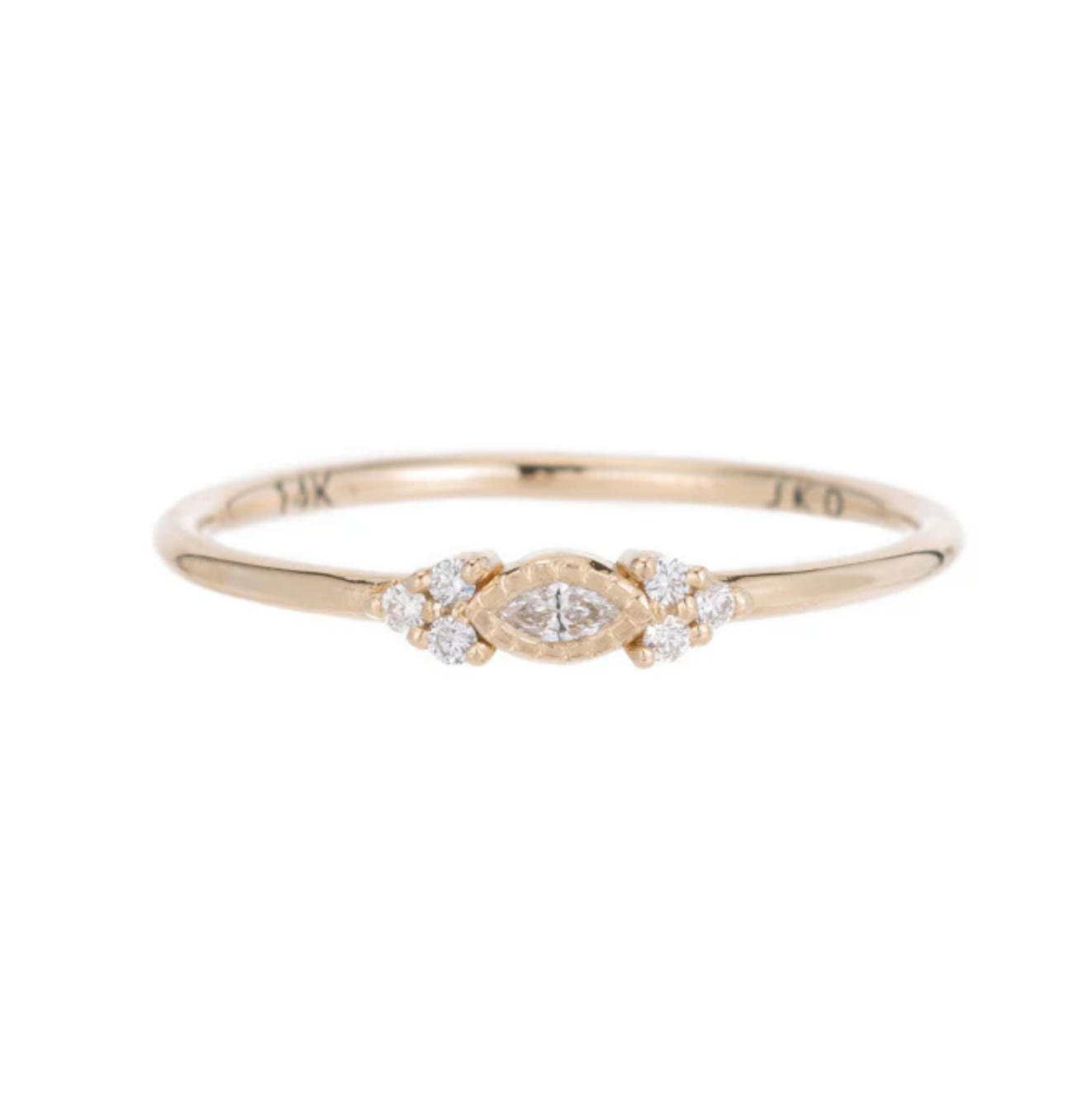 A delicate little beauty, a cobblestone cluster of brilliant diamonds surrounding a small marquise diamond with milgrain detail. 14k yellow gold ring