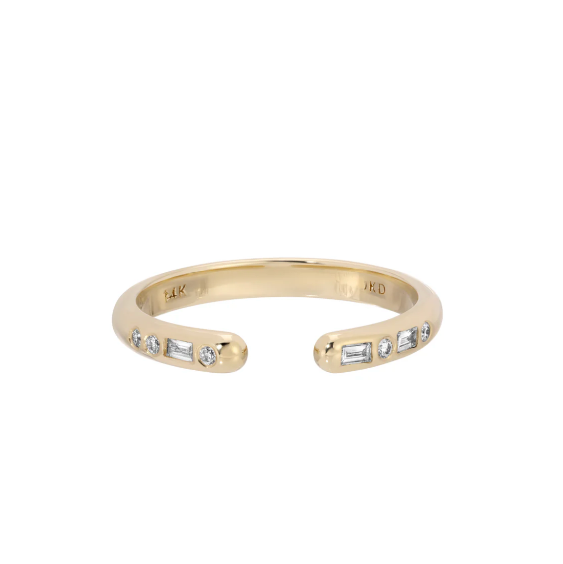 three 2 x 1.25 mm baguette diamonds
 five 1.2 mm diamonds, 14k yellow gold cuff ring A seemingly simple cuff ring, but with asymmetric, alternating baguettes and round diamonds. She's modern and classic, all at once