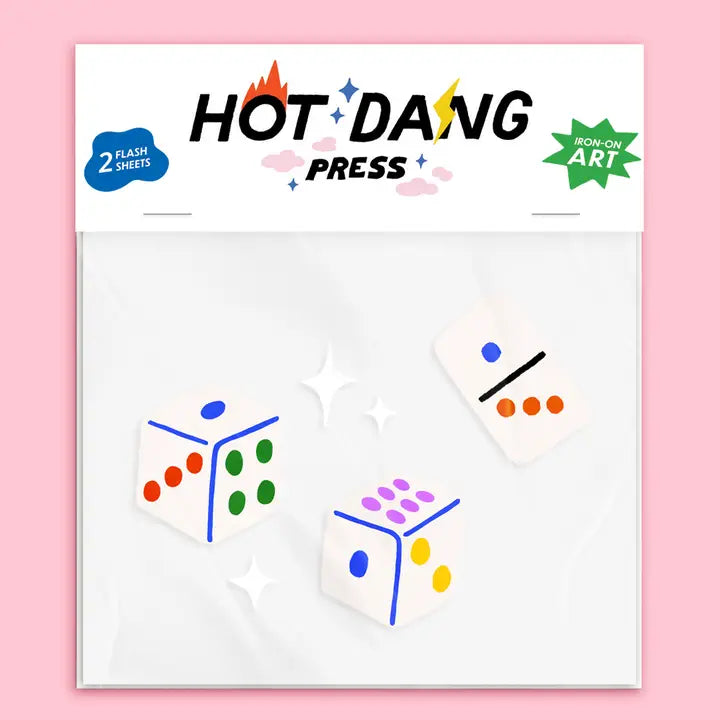 A packaged set of two flash art sheets from Hot Dang Press, featuring colorful geometric dice illustrations on a white background, set against a solid pink backdrop.