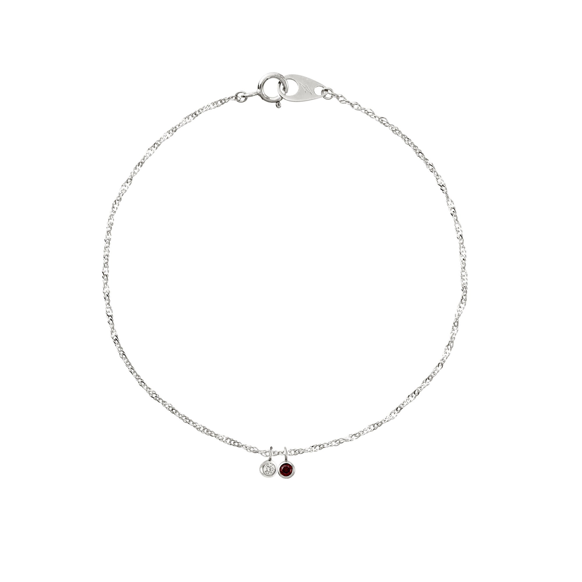 Silver bracelet with two charms on a white background