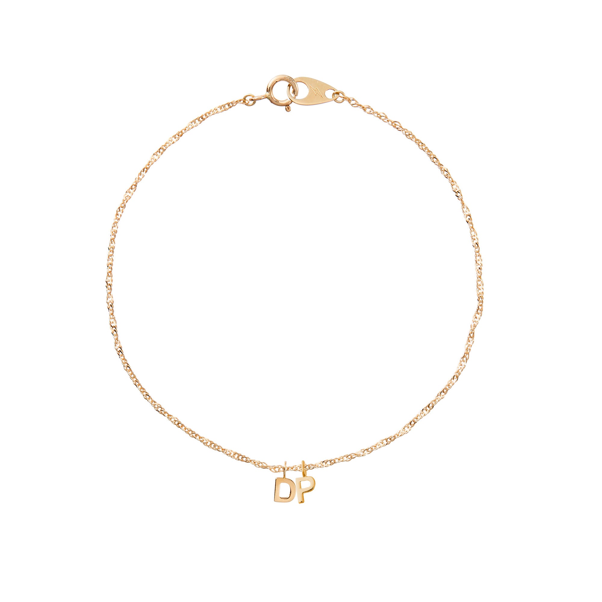 Gold bracelet with 'DP' charms on a white background