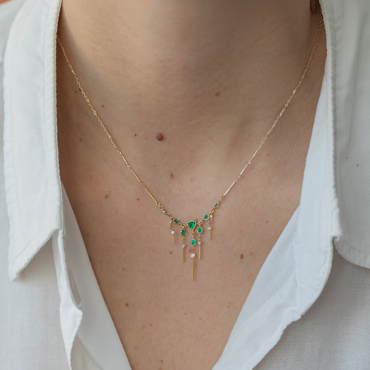 14K solid yellow gold Dream Maker necklace with openwork design, featuring 0.1 ct diamonds and 0.45 ct emerald — symbolic of manifesting dreams and clearing negative energy, 40 cm chain with adjustable links at 36 and 38 cm.