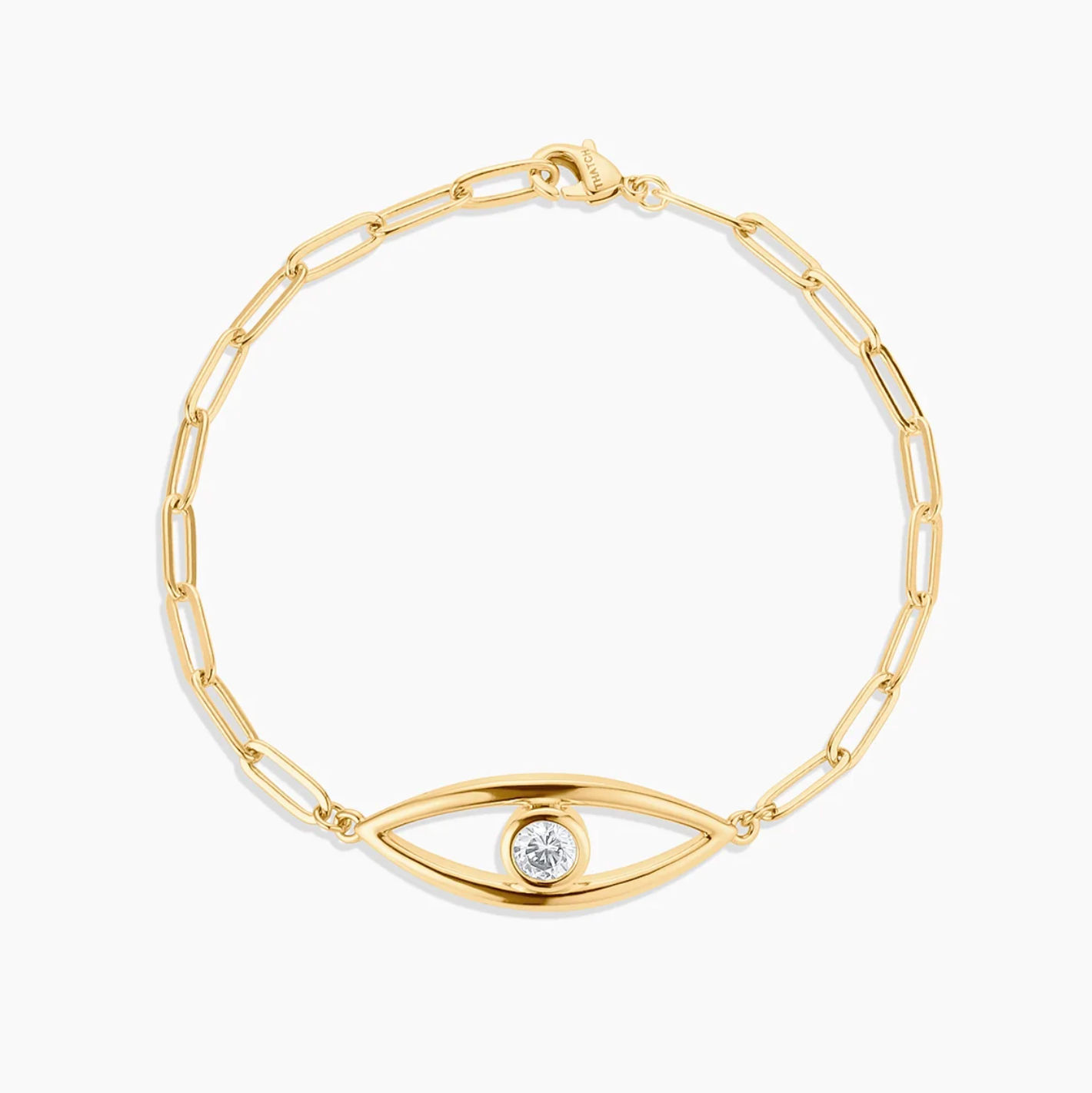 Gold bracelet with eye design on a white background