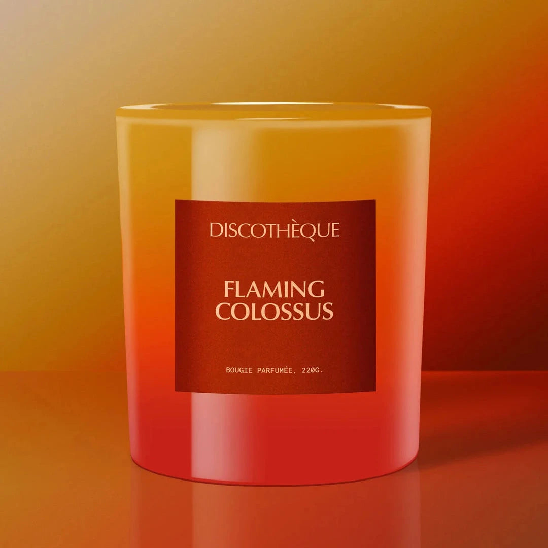 Candle with 'Discothèque Flaming Colossus' label on a gradient background