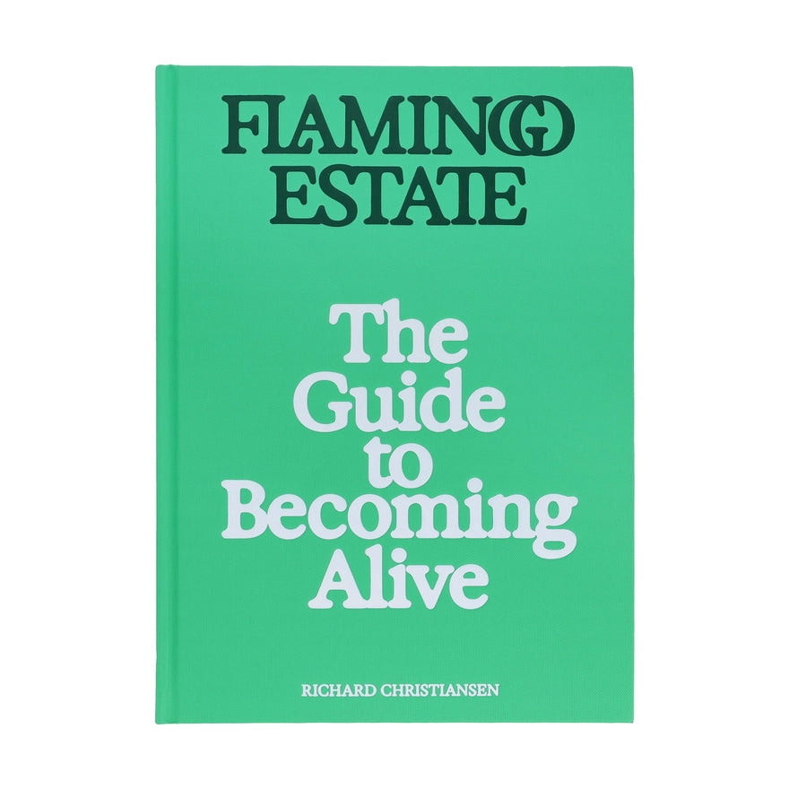 A book with a green cover and text that reads Flamingo Estate: The Guide to Becoming Alive