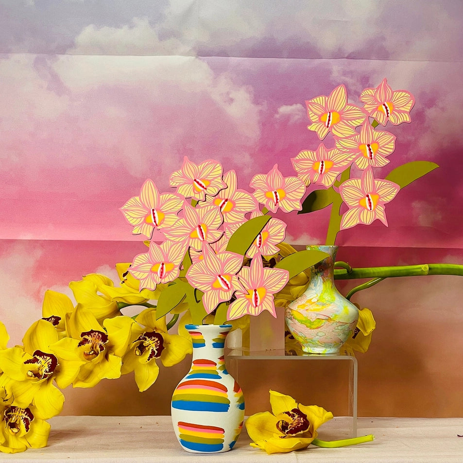 Decorative scene with yellow and pink flowers in a vase against a colorful background