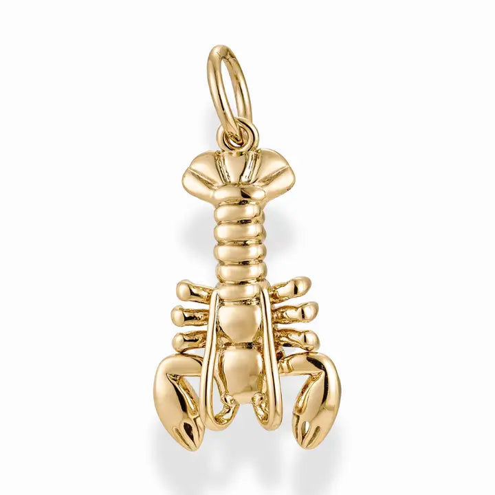 Gold lobster charm on a white background