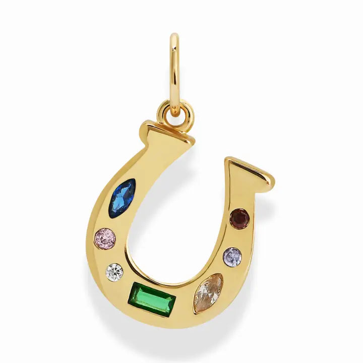 Gold horseshoe pendant with colorful gemstones on a white background