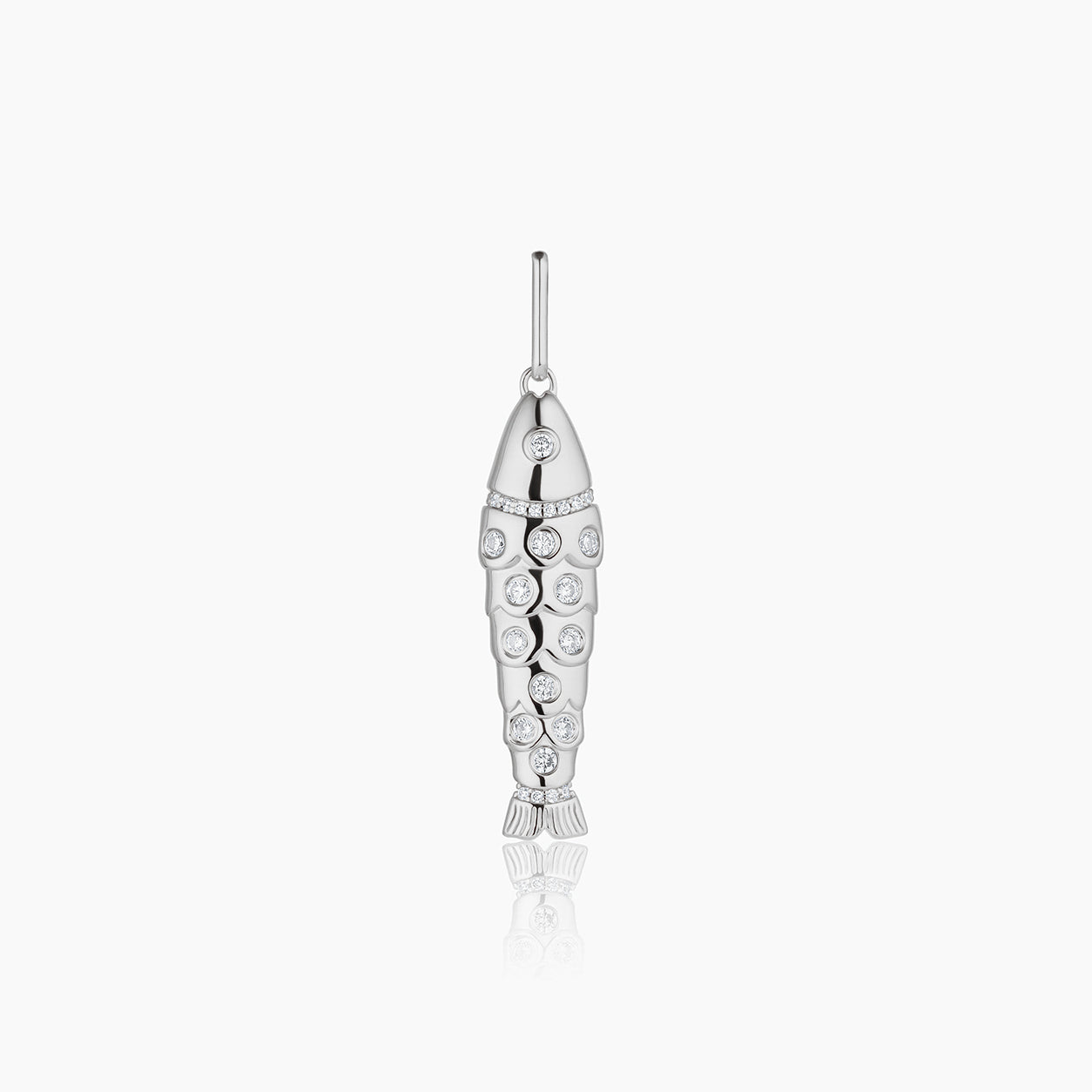 a silver fish charm with inlay white stones over a white background