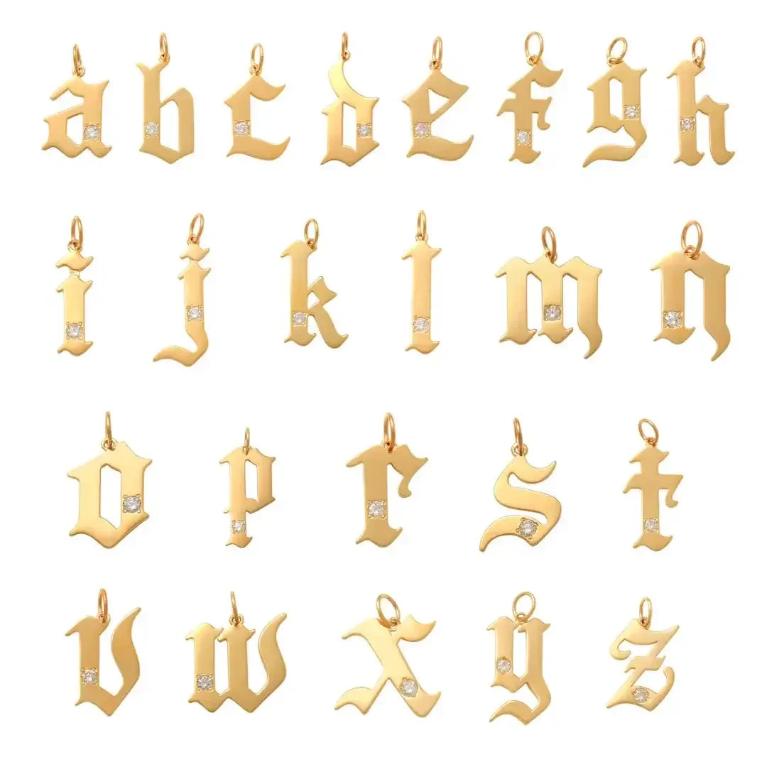 Gold letter pendants from a to z on a white background