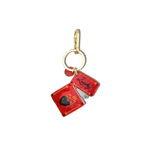 Red lighter keychain with gold ring on a white background