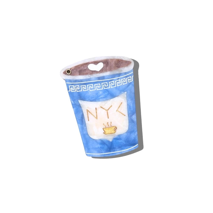 a compact mirror in the shape of a classic nyc coffee cup on a white background