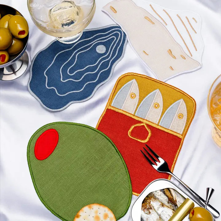 Colorful coasters with artistic designs on a white surface
