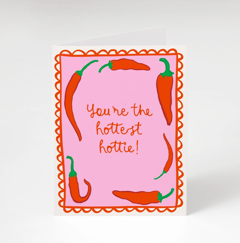 Greeting card featuring the text "You're the hottest hottie!" surrounded by colorful chili pepper illustrations, designed by Bon Femmes for Brave Daughters.