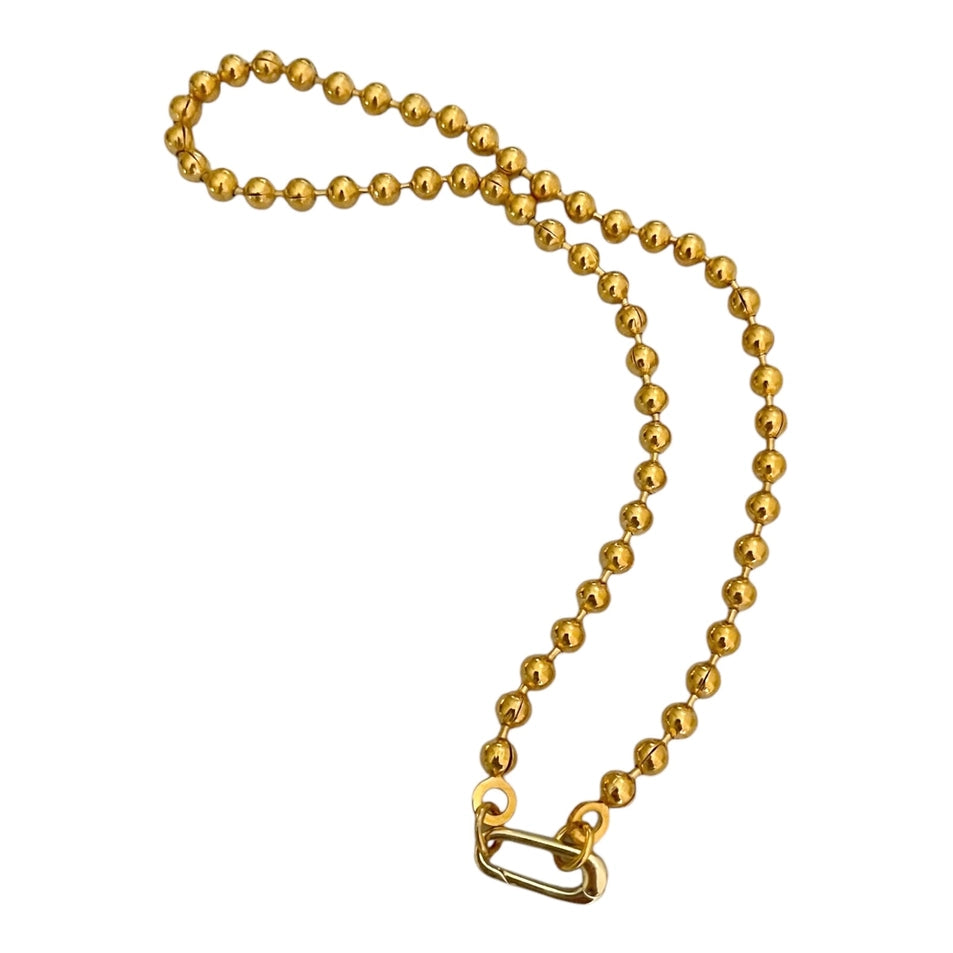Gold chain with a clasp on a white background
