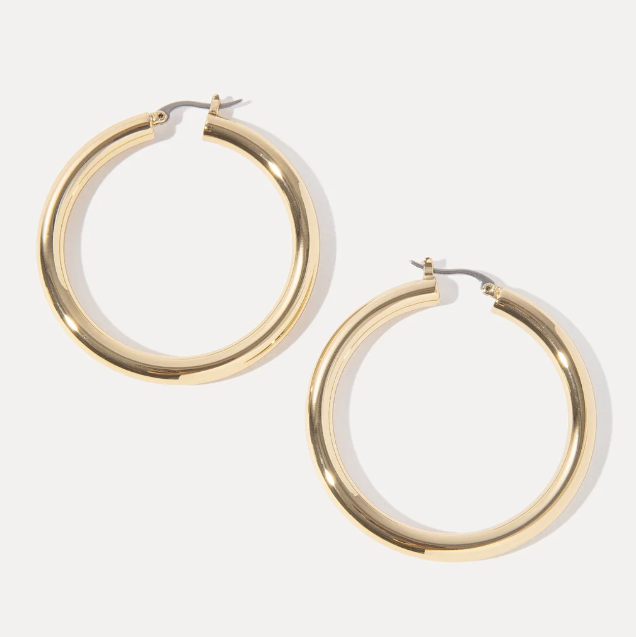 Gold hoop earrings on a white background
