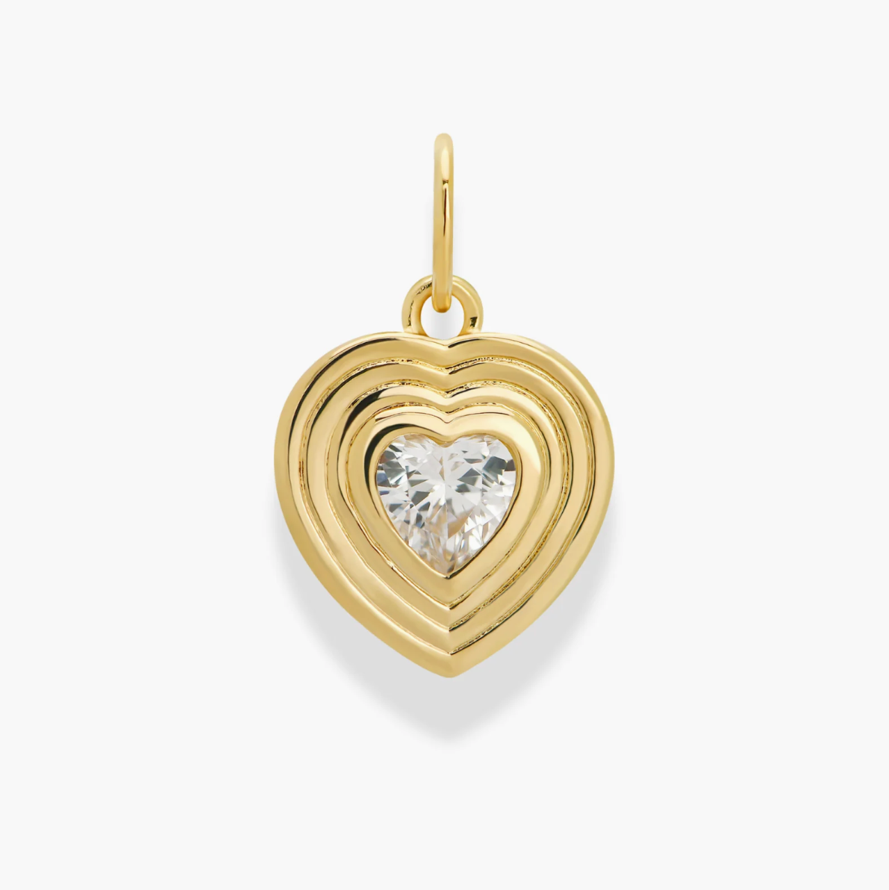 Gold heart-shaped pendant with a clear gemstone on a white background