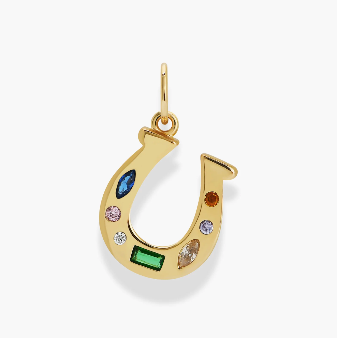 Gold horseshoe pendant with embedded colorful gemstones on a white background