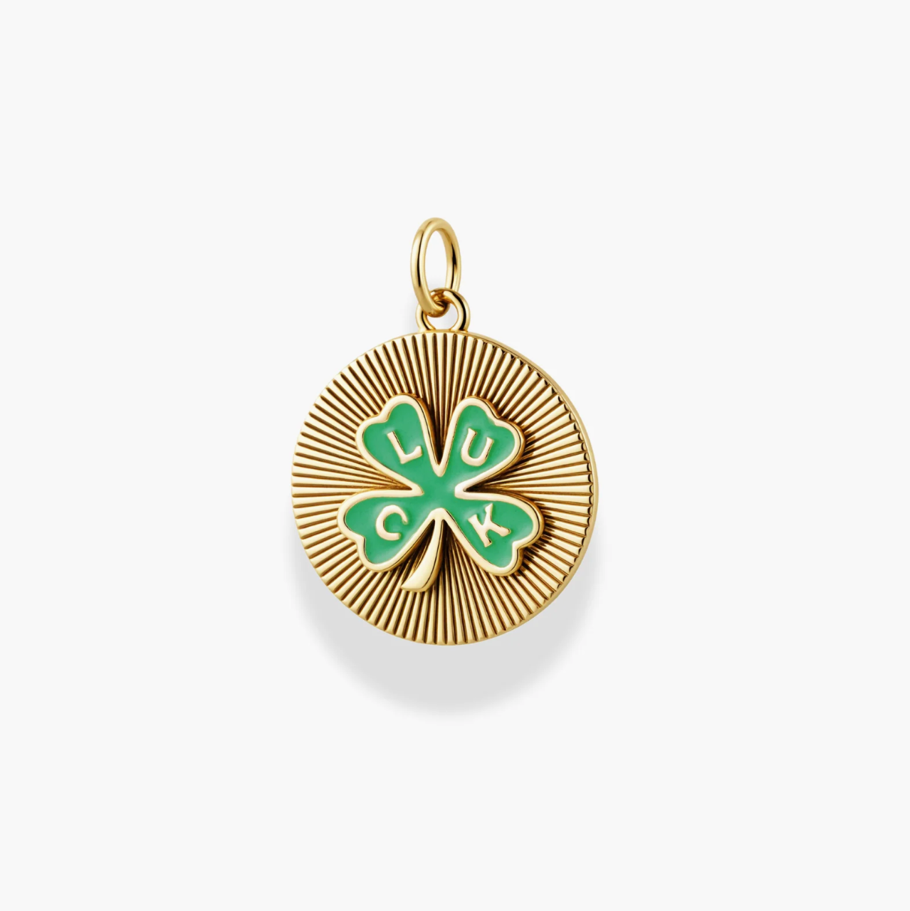 Gold pendant with green clover design and 'LUCK' text on a white background