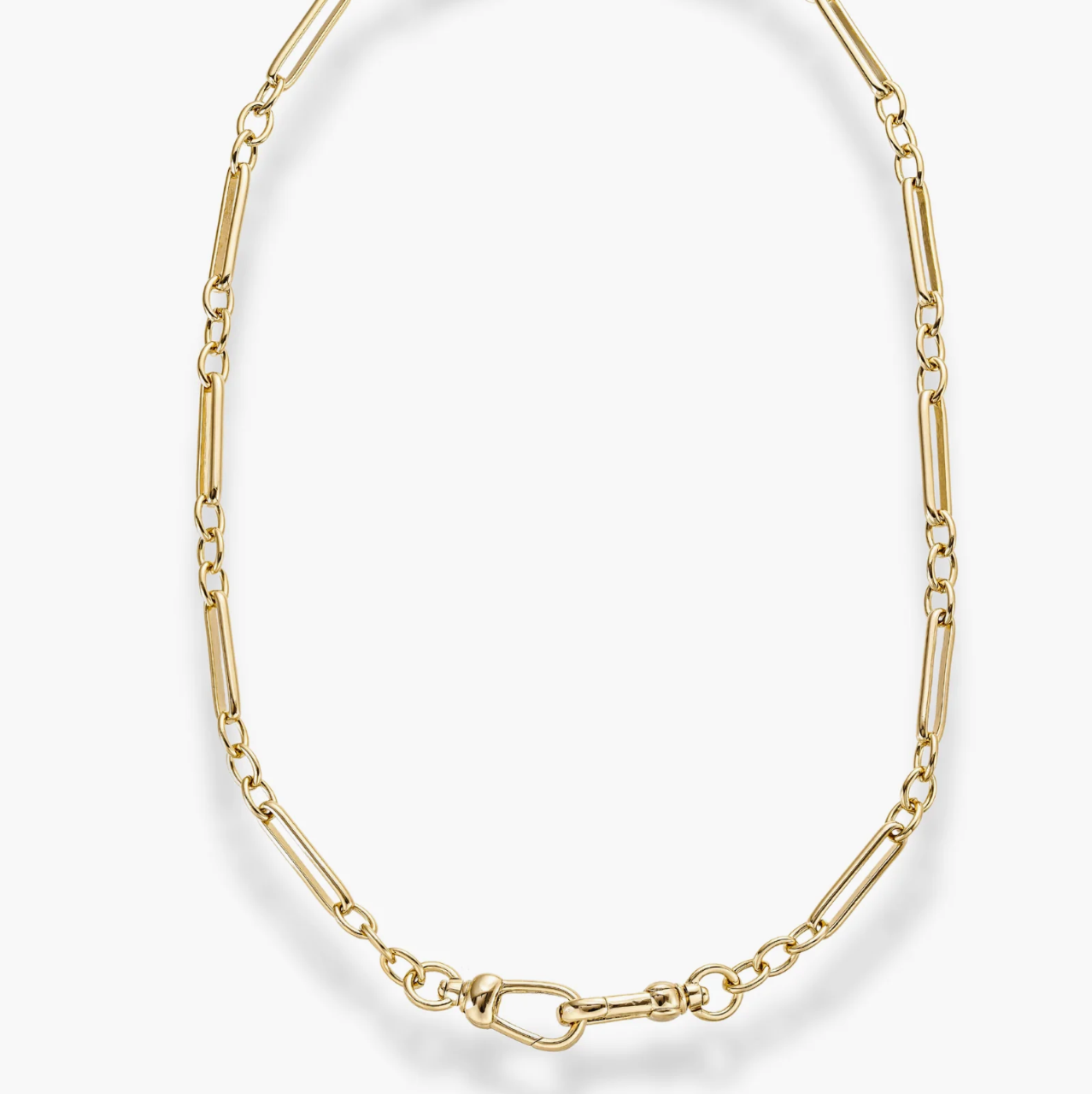 Unique gold trombone chain and double clasp front closure on a white background