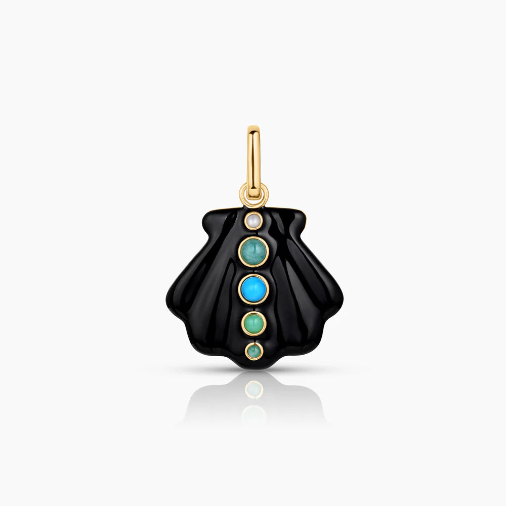 Black pendant with gold and turquoise stones on a white background